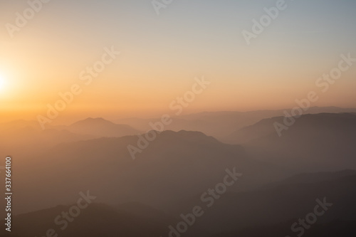 Twilight, sunrise and sea of fog in the morning on the mountains of northern Thailand, during the rainy season.