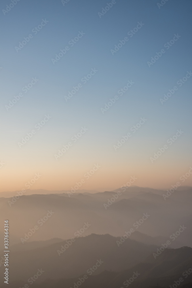 Twilight, sunrise and sea of fog in the morning on the mountains of northern Thailand, during the rainy season.