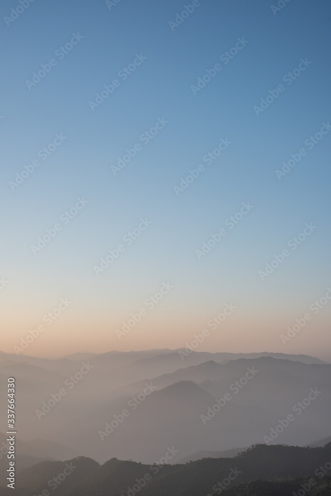 Twilight, sunrise and sea of fog in the morning on the mountains of northern Thailand, during the rainy season.