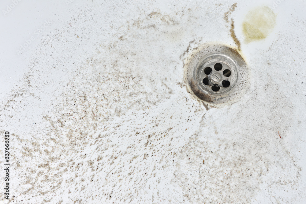 Sand and dirt in the bathroom. The concepts of cleanliness and hygiene. Close-up Sand and dirt in the bathroom. The concepts of cleanliness and hygiene. Close-up