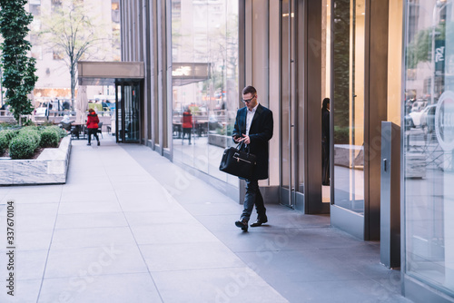 Wallpaper Mural Entrepreneur coming out from business center Torontodigital.ca