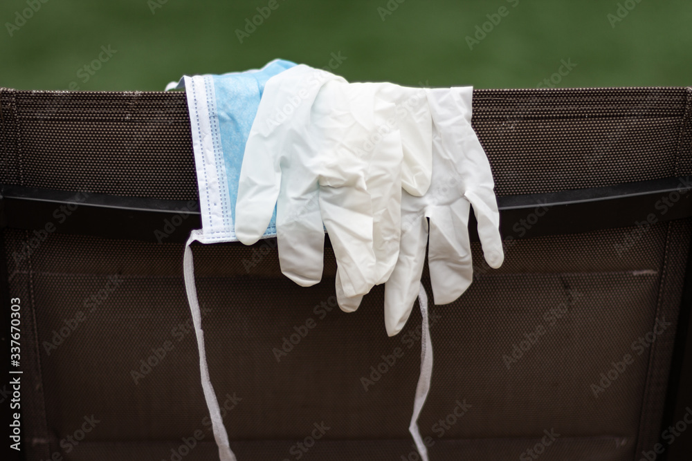 Mask and rubber gloves in a close up portrait photo