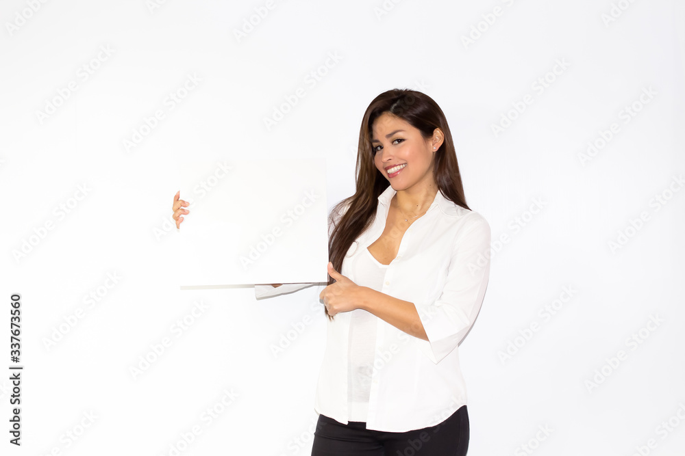 Beautiful girl hold a white board billboard smiling and is amazed surprised and happy Beautiful girl hold a white board billboard smiling and is amazed surprised and happy