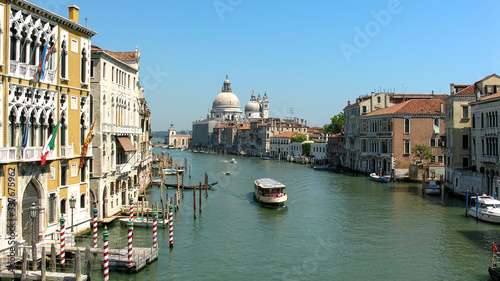 Daylight view from a bridge of The Grand Canal in Venice, Italy with boats passing.