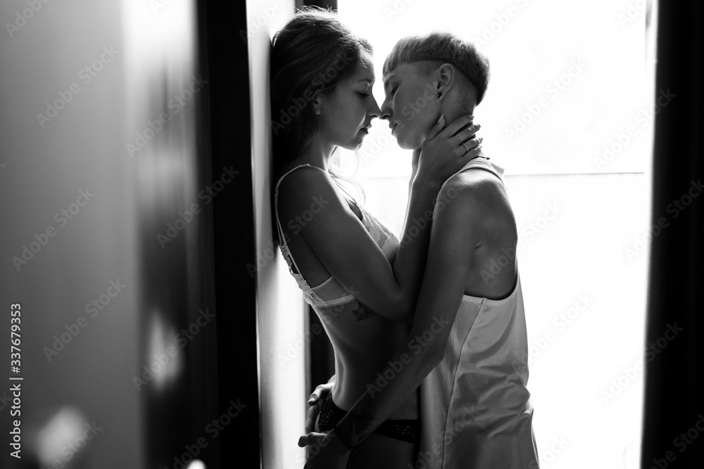 Beautiful young sexy lesbian couple tenderly hugs and kisses, love  happiness tolerance LGBT concept foto de Stock | Adobe Stock