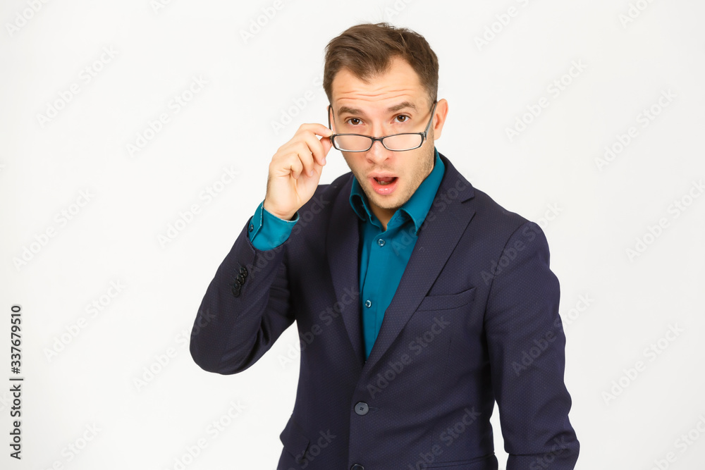 A view of a shocked young businessman isolated on white background A view of a shocked young businessman isolated on white background