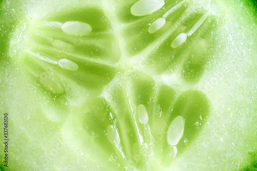 Green cucumber slices texture background, of fresh and juicy.