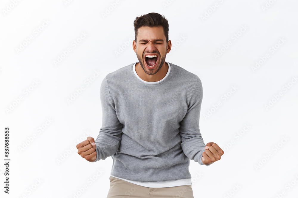 Overjoy, success and life goals concept. Ecstatic pleased and delighted good-looking man scream from happiness, heard great news, achieve success, winning, become champion, got reward Overjoy, success and life goals concept. Ecstatic pleased and delighted good-looking man scream from happiness, heard great news, achieve success, winning, become champion, got reward