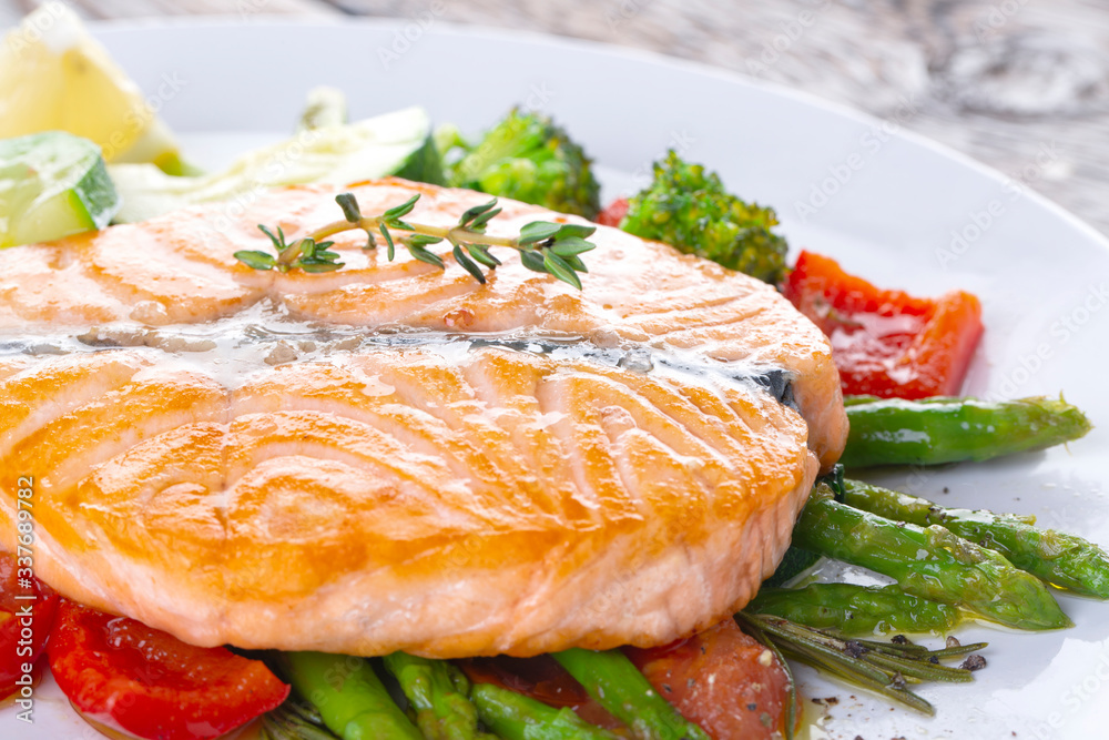 Grilled salmon steak butterfly with vegetables Grilled salmon steak butterfly with vegetables