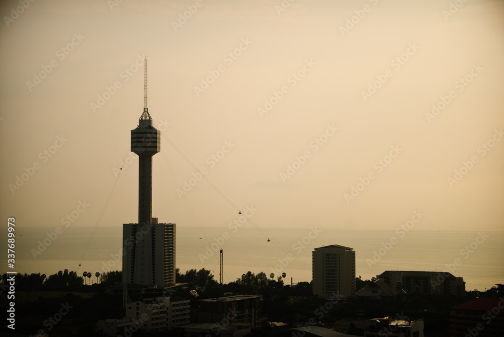 The silhouette of the Towers in the city of Pattaya on the sunset sky background