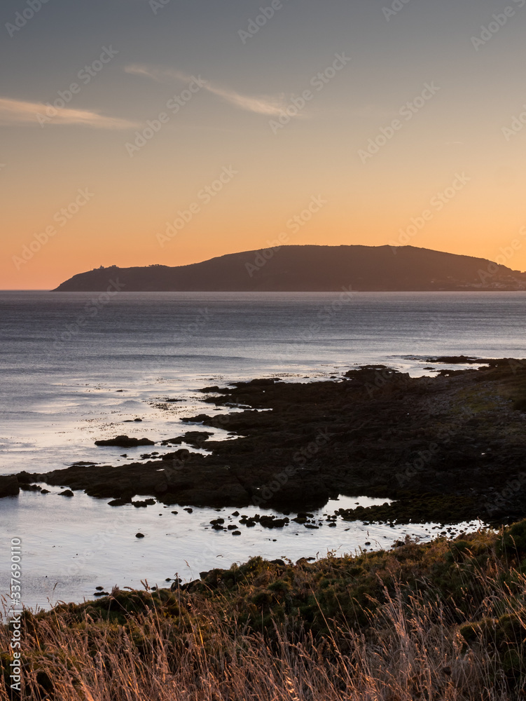 Fototapeta premium View over Finisterre from Cape Cee at sunset, Galicia, Spain