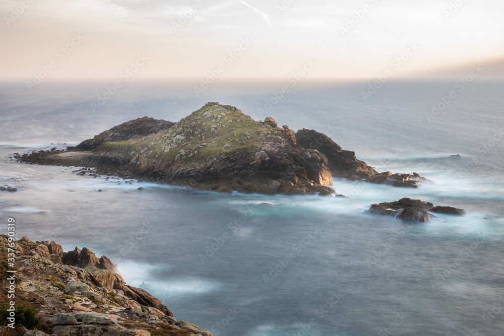 Long exposure image of Illa do Castelo, the Castle Island, at the Tourinan Lighthouse, Coast of Death, La Coruna, Galicia, Spain