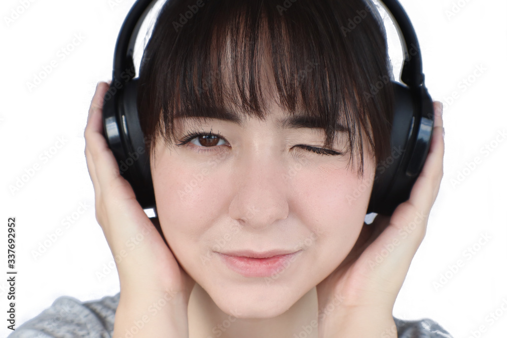 Fototapeta premium young woman listening to music