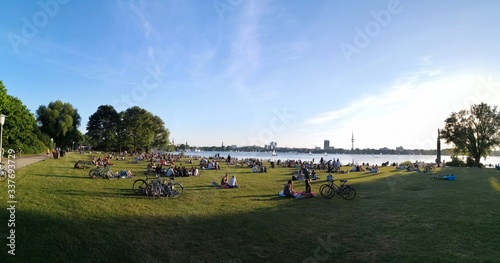 People sitting and having a barbecue at Alster Lake, Hamburg, Germany