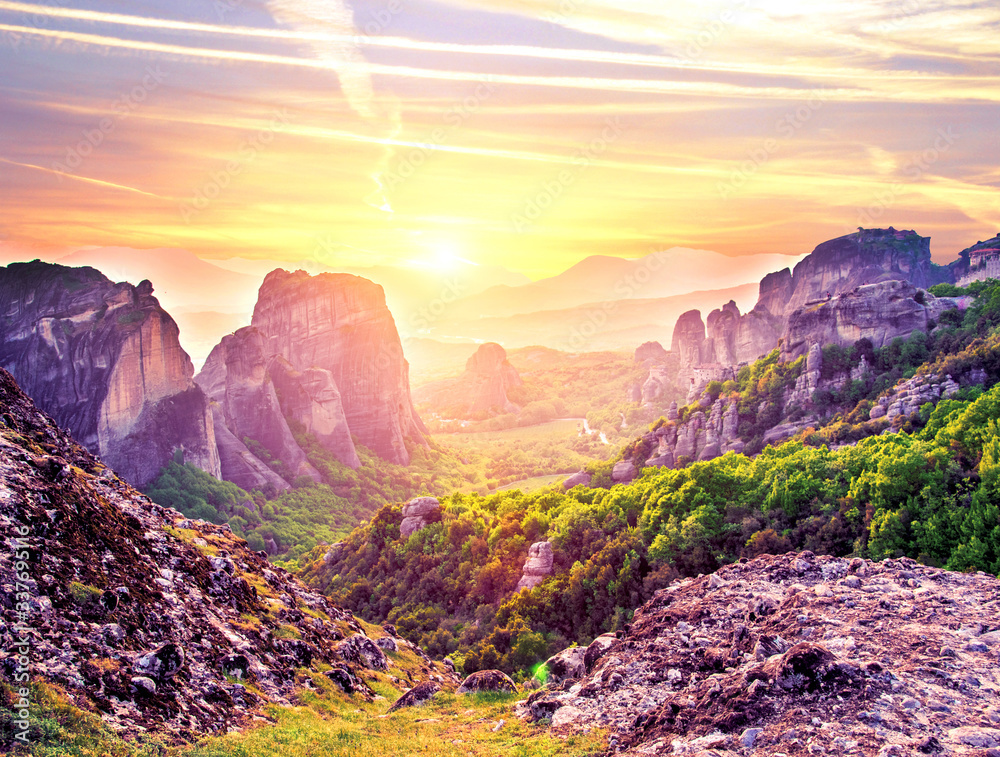 magnificent magical landscape in the famous valley of the Meteora rocks in Greece at sunset. Great amazing world. Attractions.