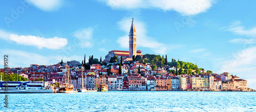 Obraz na płótnie Beautiful magical city landscape with sea, colorful houses and an ancient tower in Rovinj, Croatia. popular tourist attraction. (vacation, rest - concept) w salonie