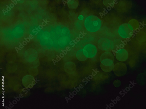 Bokeh light abstract vintage color blurred on black background. Sparkling magical dust particles. Magic concept.