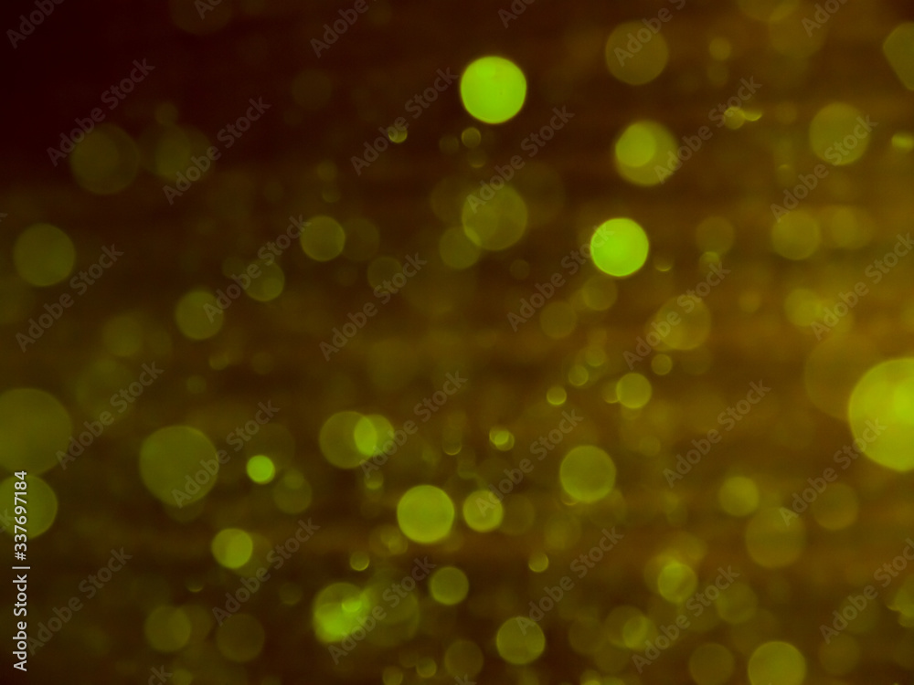 Obraz premium Bokeh lights effect isolated on black background. golden bokeh confetti and spark overlay texture.