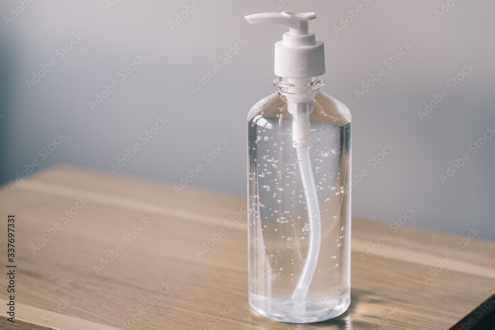 Hand sanitizer alcohol gel Anti virus protection with standard to prevent coronavirus COVID-19 infection.Medical protective on wood background.Healthcare and medical concept.
