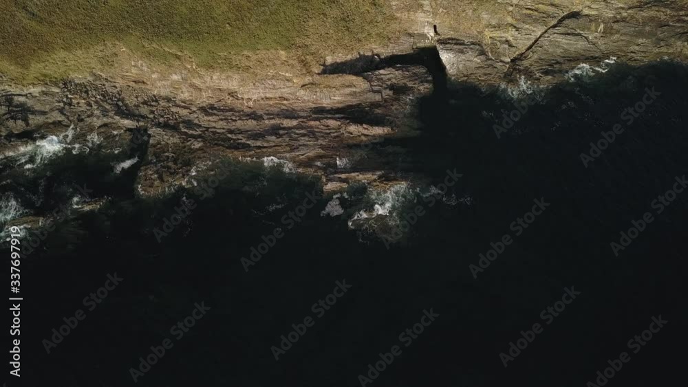 rocky shore ocean waves breaking on stones aerial survey rocky shore ocean waves breaking on stones aerial survey