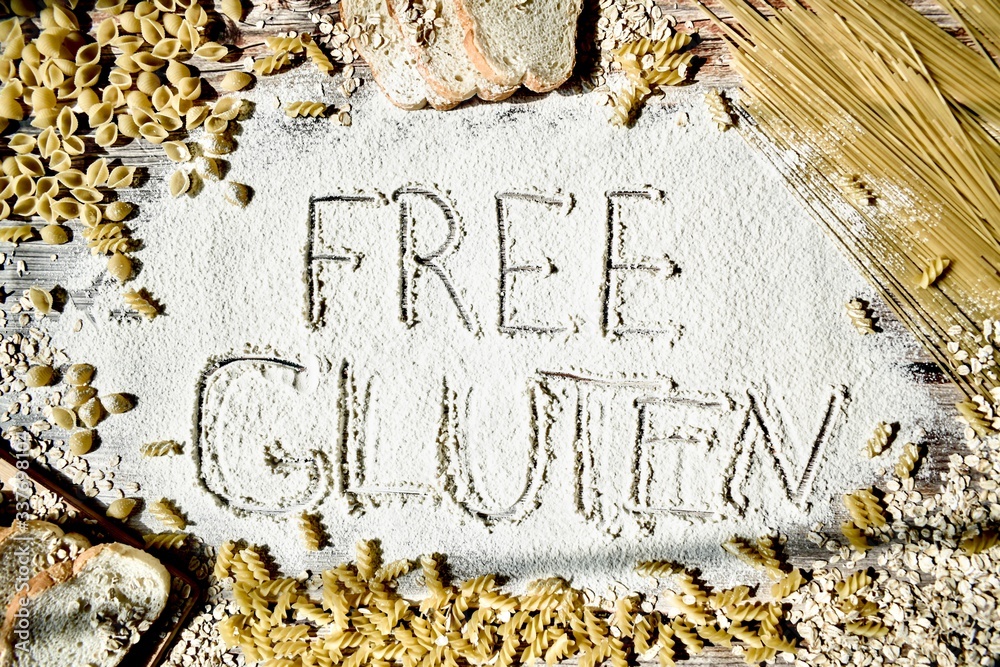 Naklejka premium Gluten-free. Assortment of pasta on a wooden table. The concept of healthy eating.