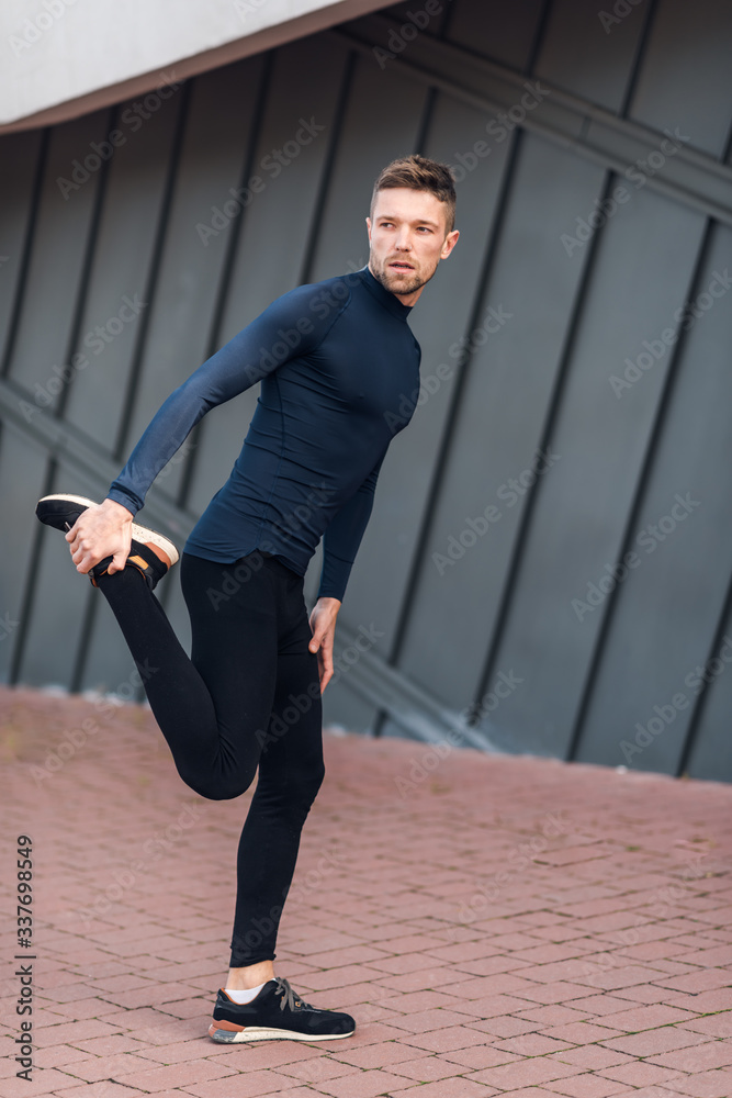 Fitness man relaxing her leg muscles. Sport, workout, healthy lifestyle concept. Fitness man relaxing her leg muscles. Sport, workout, healthy lifestyle concept.