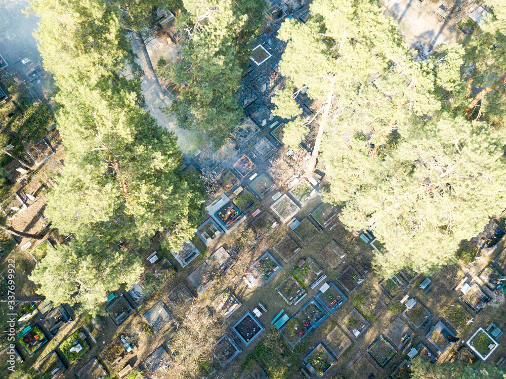 Fire in a forest cemetery. Smoke envelops conifers. Aerial drone view. Fire in a forest cemetery. Smoke envelops conifers. Aerial drone view.