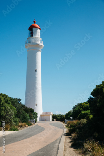 White Lighthouse in front of blue sky © Lennart