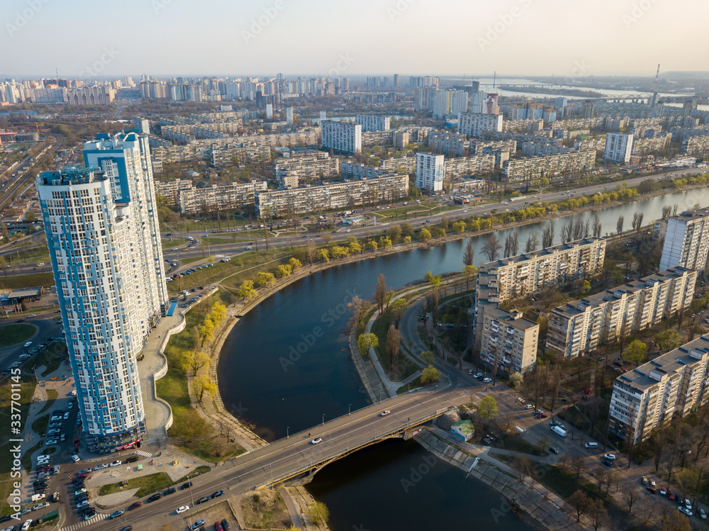 Residential area Rusanovka in Kiev in the evening sunshine. Aerial drone view.