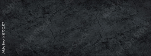 Black abstract grunge background. Banner with old cracked asphalt texture.
