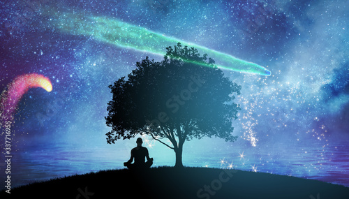 Yoga cosmic space meditation illustration, silhouette of man practicing outdoors at night photo