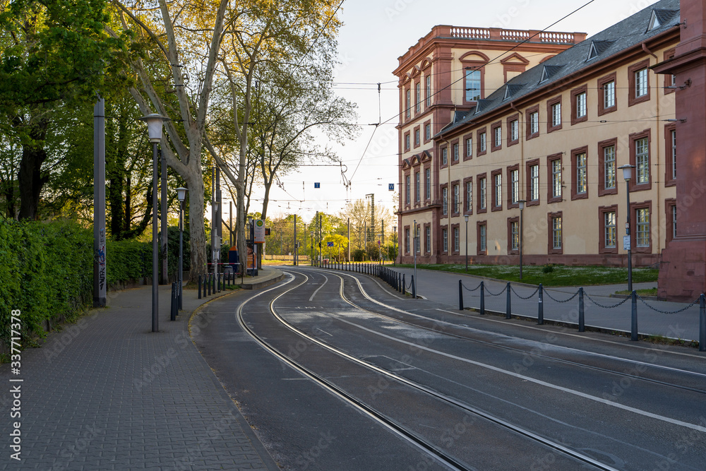 Mannheim, Germany - 10.04.2020: Mannheim Baroque Palace on spring day with tram station