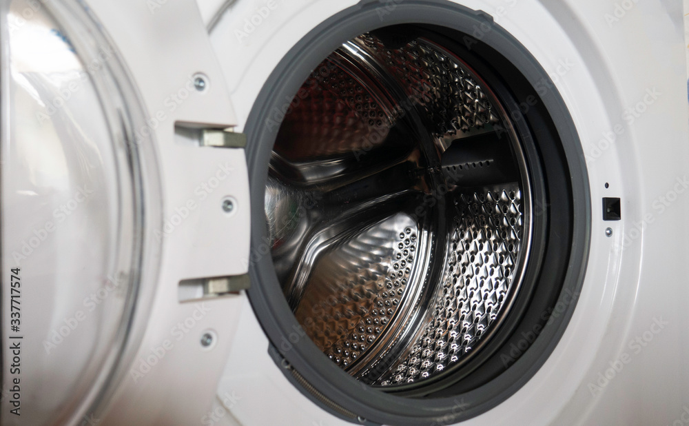 Empty open washing machine drum. Empty open washing machine drum.
