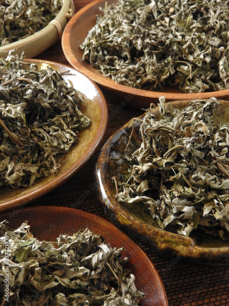 Fototapeta premium High angle view of dry mugwort on plate. Be used to ward off evil spirits and to drive away mosquitoes during the Dragon Boat Festival in Taiwan. Chinese herbal medicine.