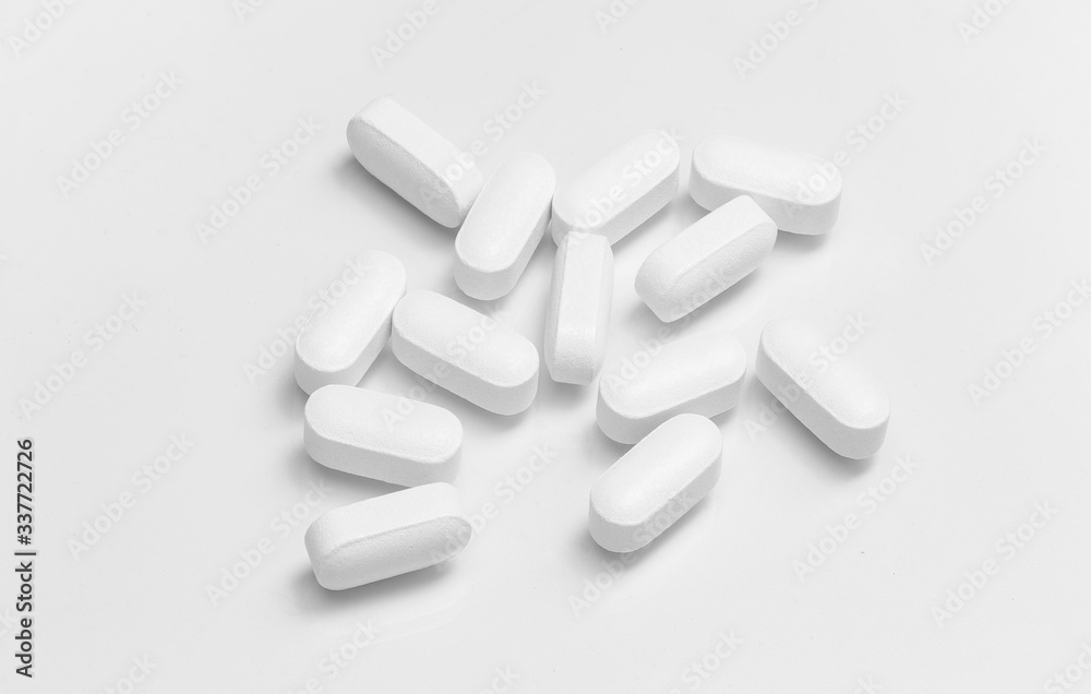 Close up White pills on temperature and virus on white background.Pharmacy and healthcare concept.