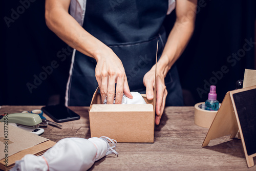 Photography Work From home concept, Man packing the product, Close-up.