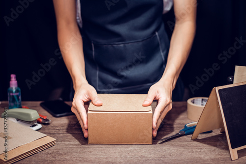 Fotografie Work From home concept, Man packing the product, Close-up.