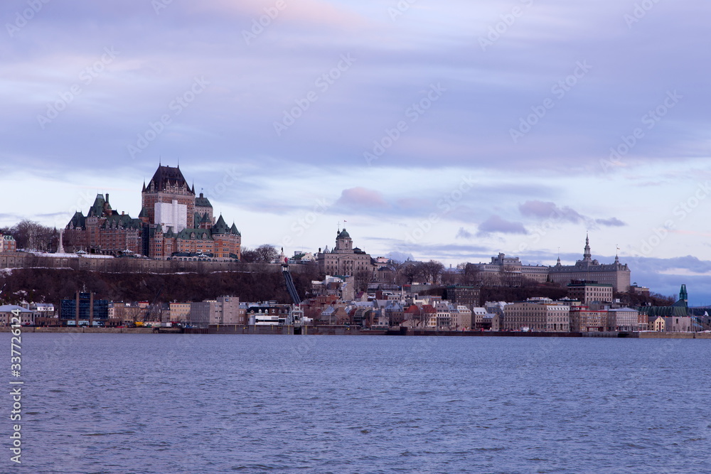Beautiful blue hour morning view of the old town skyline seen across the St. Lawrence River from Lévis, Quebec City, Quebec, Canada Beautiful blue hour morning view of the old town skyline seen across the St. Lawrence River from Lévis, Quebec City, Quebec, Canada