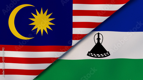 The flags of Malaysia and Lesotho. News, reportage, business background. 3d illustration photo