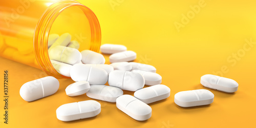 Pills and orange pill bottle on yellow background with copy space. Prescription drugs.