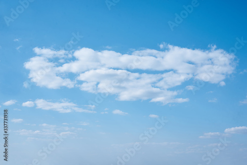 Light blue sky with white clouds. Beautiful landscape.Natural background at sunny weather in spring summer.