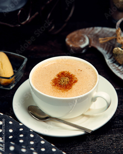 hot chocolade with cinnamon and cookie