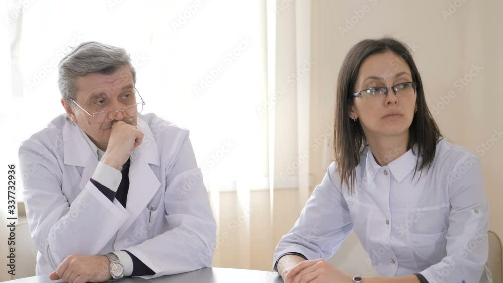 Team of caucasian doctors having a meeting in conference room. Healthcare and science concept Team of caucasian doctors having a meeting in conference room. Healthcare and science concept