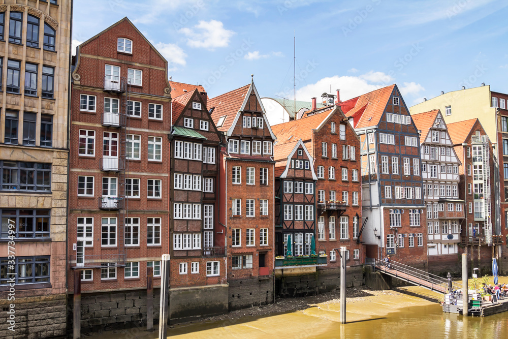 Hamburg, Germany : historic buildings on bank of Nikolaifleet canal on clear summer day
