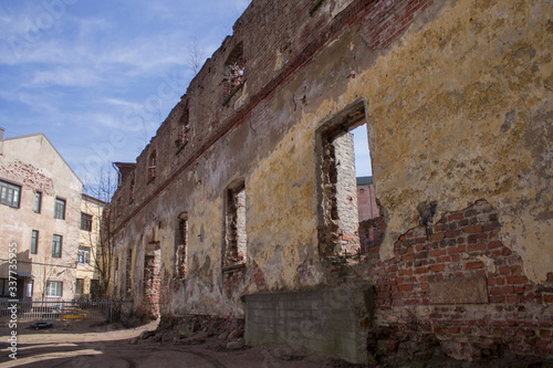 an old red brick building destroyed by time