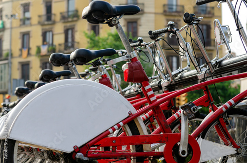 Photography city tourist red bicycles for hire and rent