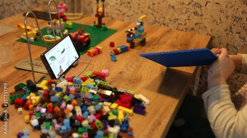 Little girl online learning and creating at home. Quarantine and Social distancing concept.