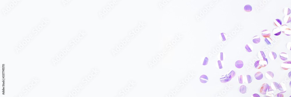 Pearl confetti on white background. Flat lay, top view. Pearl confetti on white background. Flat lay, top view.