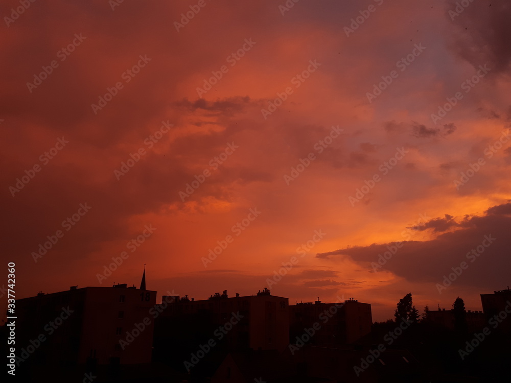 Silhouettes of buildings on the sunset background - Poland, Oborniki 
