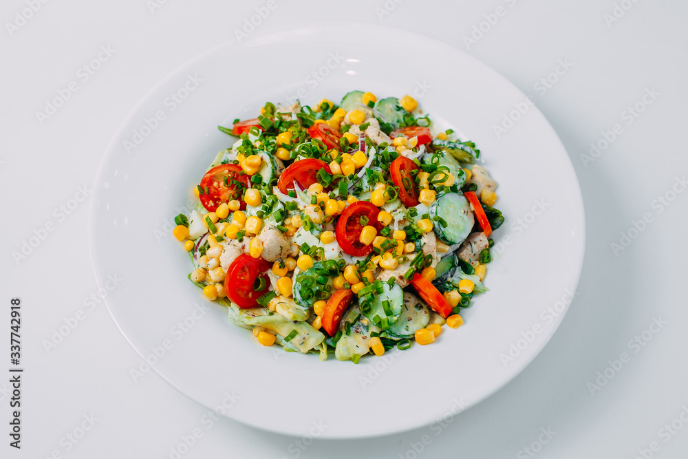 sweet corn, tomato and chicken salad, healthy food isolated on white background sweet corn, tomato and chicken salad, healthy food isolated on white background